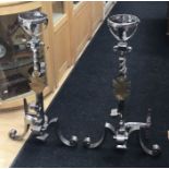 A pair of large polished steel andirons, made in the Arts & crafts manner, with an applied brass