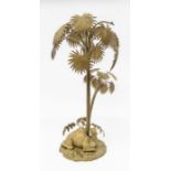 A cast metal centrepiece modelled as a resting camel beneath a palm tree (A.F. to one leaf)