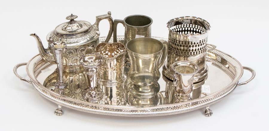 A large silver plated serving tray, a plated tea pot, bottle holders, tankards posy vases and a