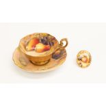 Royal Worcester - a handpainted breakfast cup and saucer with fallen fruits by Ricketts (damage to