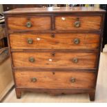 A George III mahogany chest of drawers - two above three drawers