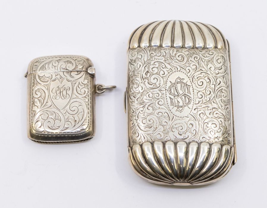 A Victorian silver engraved oblong shaped cigarette box, gadroon ends, gilt interior, hallmarked