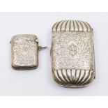A Victorian silver engraved oblong shaped cigarette box, gadroon ends, gilt interior, hallmarked