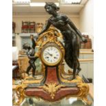 A late 19th century French spelter mantel clock with Art Nouveau lady and putti on gilt detailed