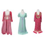 A deep pink Indian dress edged in gold; a sky-blue Indian type dress embellished in silver; a