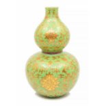 ***WITHDRAWN***A rare pale green ground and gilt ‘lotus’ double gourd vase, Qianlong seal mark and