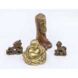 A group of Asian metal ware to include: brass Buddha; dragon and Dog of Fo paperweights and an