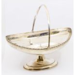 A George V silver swing handle bread basket, with pierced work and engraved inscription "Presented