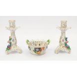 A pair of Dresden porcelain candlesticks, together with a matching petal dish with flower detail