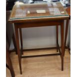 An Edwardian flip-top mahogany card/tea table, together with another Edwardian mahogany oval