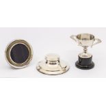 A collection of silver to include; a silver capstan inkwell with liner, hallmarked Birmingham, 1939,
