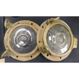 A pair of solid brass early 20th century boat portholes with bull's-eye glass