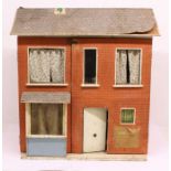 Dolls House: A mid-late 20th century dolls house, with an assortment of dolls house furnishings