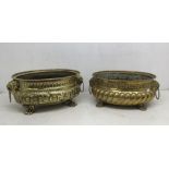 2 19th century Victorian repousse decorated brass planters. Each with lion paw feet, and lion’s head