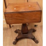 A 19th century Victorian mahogany sewing/work table with drop-leaf sides on four lion's feet