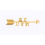 A gold arrow brooch, with initials AR DEN, length approx 38mm, unmarked assessed as 15ct gold, C