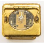 A brass carriage clock with two-train, spring-driven movement chiming on two gongs with alarm. White