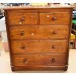 A 19th century Victorian mahogany and walnut chest of two over three drawers with knob handles