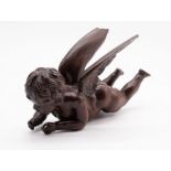 A 19th century cherub carved in hardwood