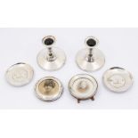 A collection of silver to include; A pair of Birmingham silver small candlesticks, hallmarked