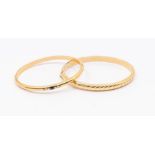 Two 14ct gold hollow bangles, to include a sapphire and diamond set D section bangle set to the