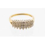 A diamond and 18ct gold cluster ring comprising a triple row of round brilliant cut diamonds,