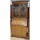 A George III mahogany bureau bookcase with glazed top - original glass - and two above three