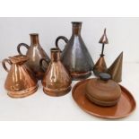 A collection of graduated copper measure jugs, measures, funnels, tray and foot warmer