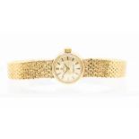 Omega -  ladies  "Ladymatic" 9ct gold wristwatch, comprising a round signed champagne dial with