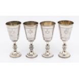 Judaica: A set of four early 20th Century silver Kiddush cups with engraved Star of David to