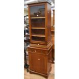 A reproduction mahogany display cabinet, a mahogany cupboard and a reproduction mahogany bureau