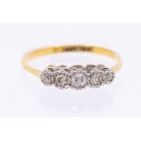 An diamond and 18ct gold five stone ring, comprising five graduated diamonds, widest width approx