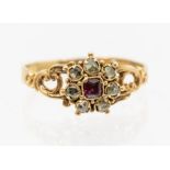 A 19th century garnet and diamond gold mourning ring, the centre set with a cushion cut garnet