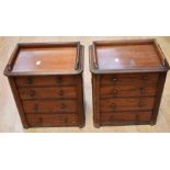 A pair of 19th century mahogany miniature chests of four drawers, with gallery tops