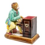 A French 19th century Majolica spill vase in the form of a monkey playing piano, made by