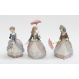 Three Lladro figurines of young ladies with parasols