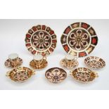 A collection of Royal Crown Derby china 1128 Imari: plates, coffee cans, saucers and pin dishes