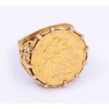 A George V sovereign dated 1911, within a fancy pierced 9ct gold ring mount, size S, total gross