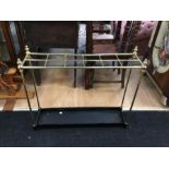 A brass and steel stick stand. With 12 divisions, turned brass baluster finials and a painted