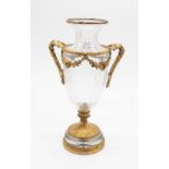 A 19th century cut glass table vase with gilt metal. Adams design with twin-handles and a glass