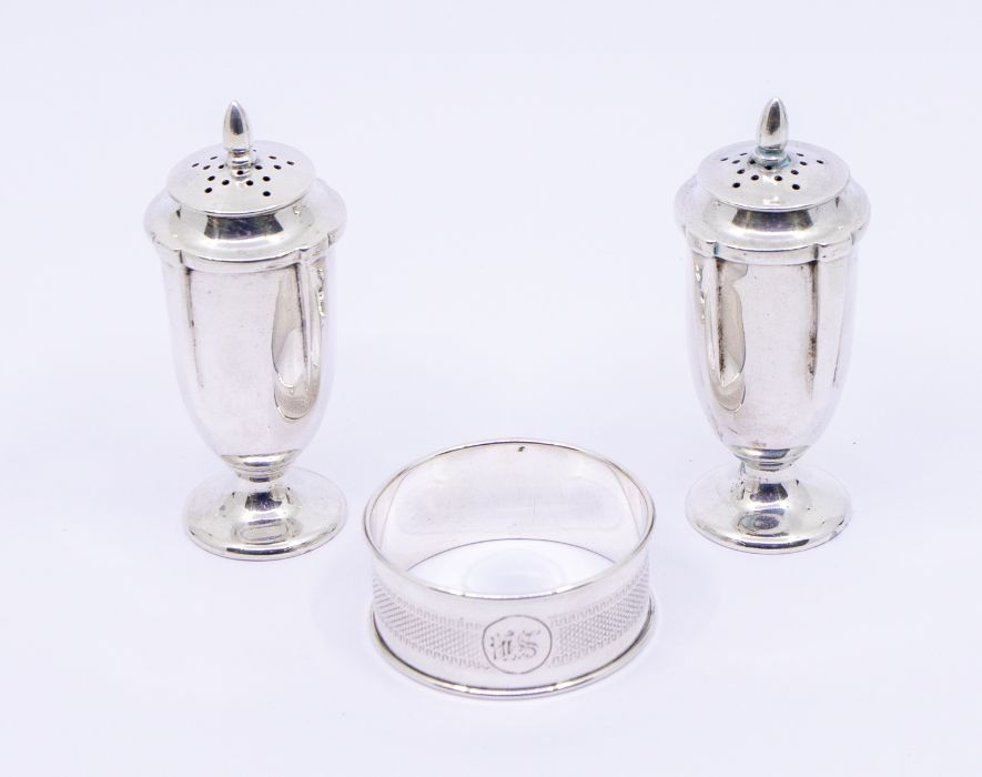 A pair of Edwardian silver pepper pots, hallmarked  Birmingham, 1906 and a silver engine turned - Image 3 of 3