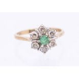 An emerald and diamond and 9ct gold cluster ring, comprising a flower head set with a central