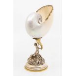 A Modern silver and silver gilt mounted nautilus shell shell cup in the Baroque manner, domed foot