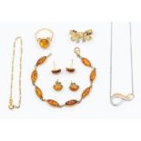 A collection of amber set 9ct gold jewellery to include a bracelet set with oval links, length