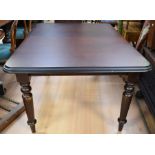 A wind-out Victorian-style dining table with a single leaf.