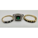 Two 9ct gold dress rings: A 9ct white gold synthetic Emerald and diamond ring, size K 1/2, gross