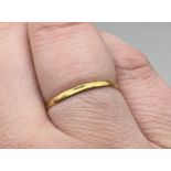 A 22ct gold wedding band. Size M. Gross weight approximately 1.0 grams. Marked for Birmingham 1937.