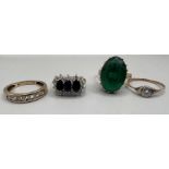 A selection of four yellow metal dress rings comprising an illusion set diamond ring,, stamped "