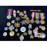 4 medals and selection of cap badges and various other pin badges.