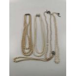 5 strings of cultured and simulated pearls to include one with a 9 carat white gold clasp and